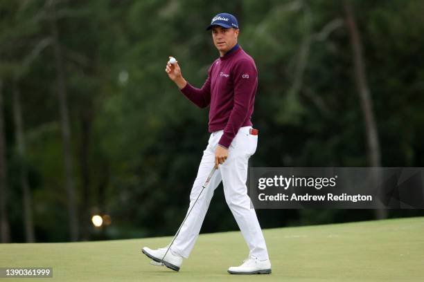 Justin Thomas reacts after making par on the 18th green during the second round of The Masters at Augusta National Golf Club on April 08, 2022 in...