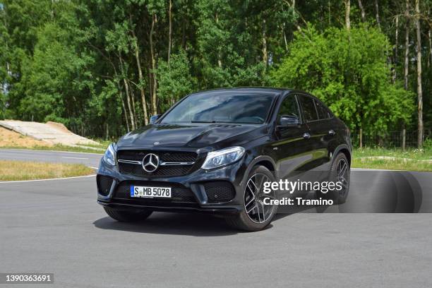 mercedes-benz gle coupe on a road - daimler ag stock pictures, royalty-free photos & images