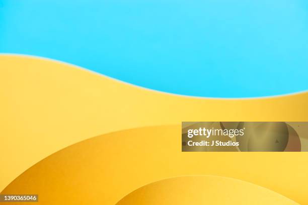 abstract background in yellow and blue - yellow background stock pictures, royalty-free photos & images