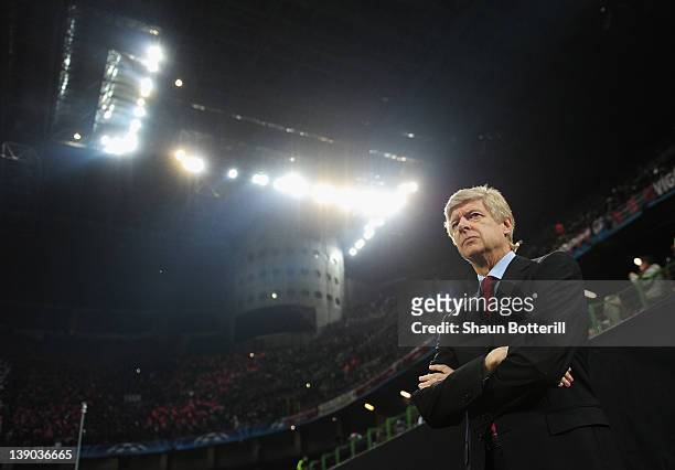 Arsene Wenger, manager of Arsenal looks on during the UEFA Champions League round of 16 first leg match between AC Milan and Arsenal at Stadio...