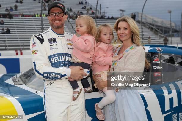 Dale Earnhardt Jr, driver of the Hellmann's Fridge Hunters Chevrolet, poses for photos with his wife Amy Earnhardt, and their daughters Isla Rose and...