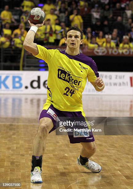 Bartlomiej Jaszka of Berlin throws the ball during the Toyota Handball Bundesliga match between Fuechse Berlin and SC Magdeburg at Max Schmeling hall...