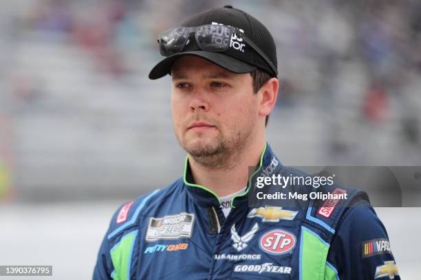 Erik Jones, driver of the FOCUSfactor Chevrolet, walks the grid during practice for the NASCAR Cup Series Blue-Emu Maximum Pain Relief 400 at...