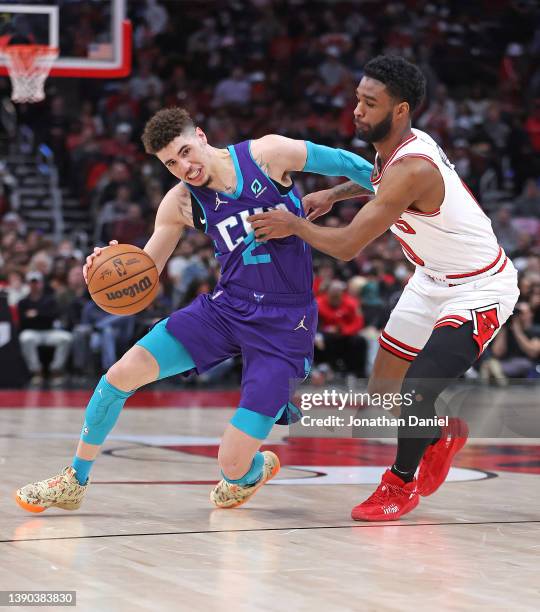 LaMelo Ball of the Charlotte Hornets drives against Coby White of the Chicago Bulls at the United Center on April 08, 2022 in Chicago, Illinois. NOTE...