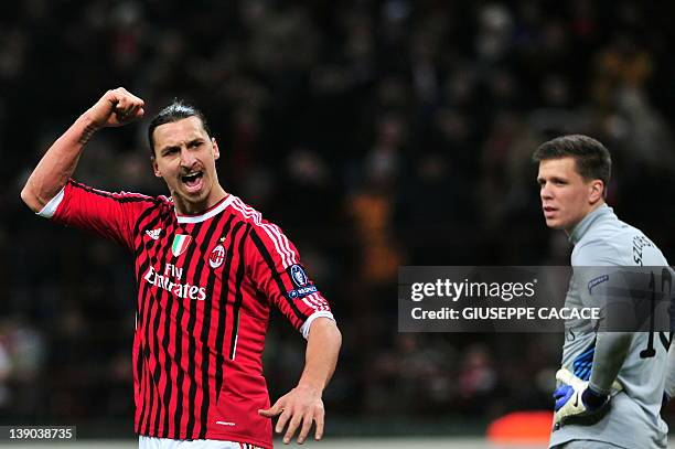 Milan's Swedish forward Zlatan Ibrahimovic celebrates after scoring a penalty during the UEFA Champions League round of 16 first leg match AC Milan...