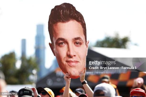 Fan of Lando Norris of Great Britain and McLaren holds a cardboard cutout of his head at the fan stage prior to final practice ahead of the F1 Grand...