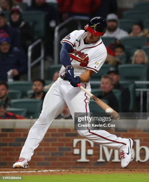 Matt Olson of the Atlanta Braves hits a double in the sixth inning against the Cincinnati Reds at Truist Park on April 08, 2022 in Atlanta, Georgia.