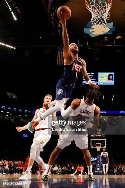 Bruce Brown of the Brooklyn Nets goes to the basket as Isaac Okoro and Lauri Markkanen of the Cleveland Cavaliers defend during the game at Barclays...