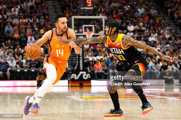 Landry Shamet of the Phoenix Suns drives into Jordan Clarkson of the Utah Jazz during the first half of a game at Vivint Smart Home Arena on April...