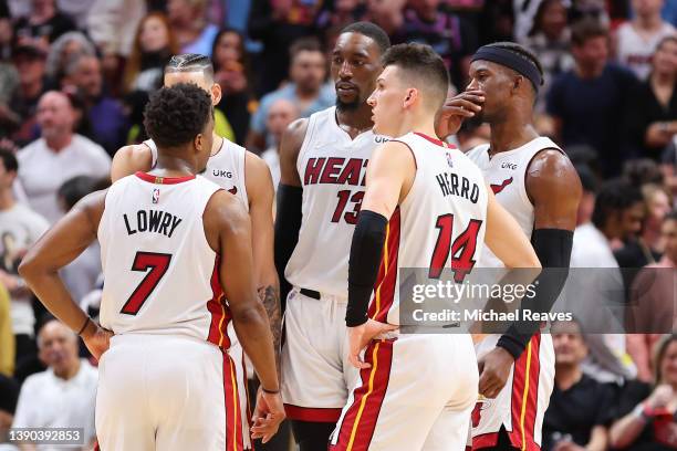 Kyle Lowry, Caleb Martin, Bam Adebayo, Tyler Herro and Jimmy Butler of the Miami Heat look on against the Atlanta Hawks during the second half at FTX...