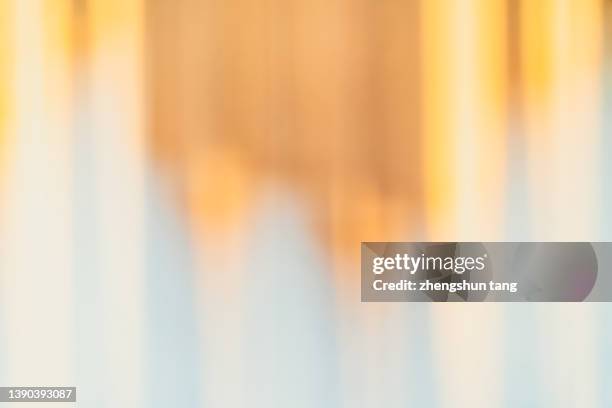 golden stripe pattern on the wall. - out of focus background stock pictures, royalty-free photos & images