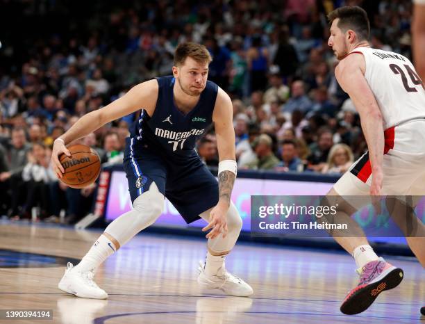 Luka Doncic of the Dallas Mavericks is guarded by Drew Eubanks of the Portland Trail Blazers in the second half at American Airlines Center on April...