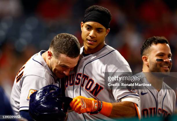 Jeremy Pena of the Houston Astros celebrates his first MLB home run with Alex Bregman against the Los Angeles Angels in the seventh inning at Angel...