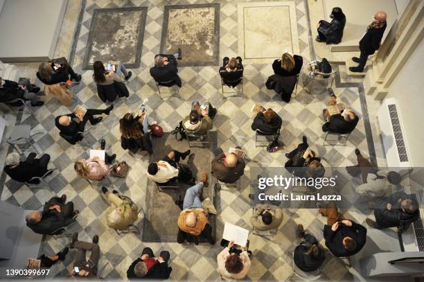 View of the press conference as attendees sit socially distanced due to the anti-Covid measures the day before the opening of the exhibition 'Vittore...