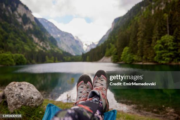 view of the lake and mountains through the open window of the tent - pov shoes stock pictures, royalty-free photos & images