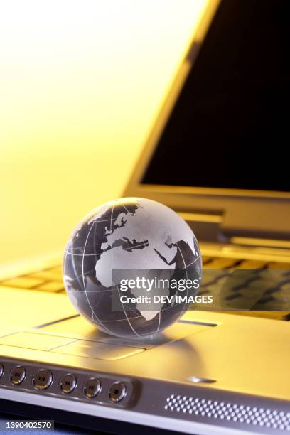 glass globe on computer keyboard - glass map india stock pictures, royalty-free photos & images