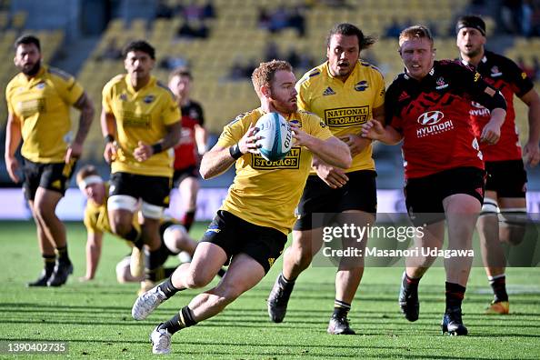 Jaime Booth Rugby Jamie Booth of the Hurricanes runs with the ball during the round ...