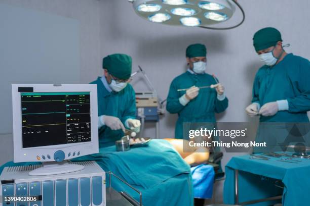 filming in the studio - dead patient surgeon doctor covering face on bed finished operate. - hospital death stock pictures, royalty-free photos & images