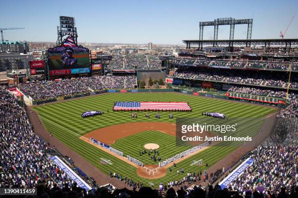 General view of the stadium during National Anthem before a game between the Colorado Rockies and the Los Angeles Dodgers on Opening Day at Coors...