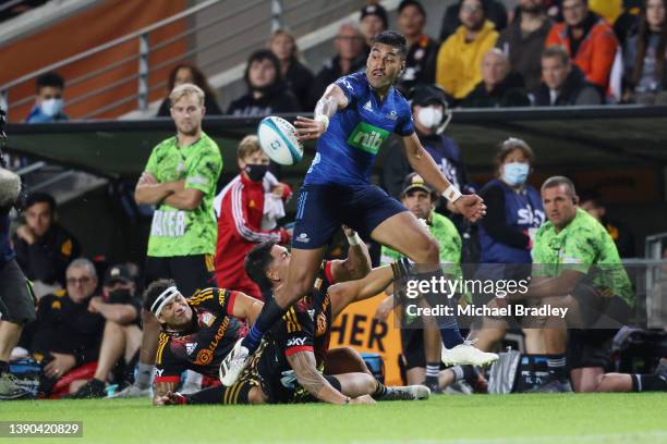 Reiko Ioane of the Blues offloads the ball during the round eight Super Rugby Pacific match between the Chiefs and the Blues at FMG Stadium Waikato...