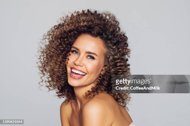 beautiful woman with perfect curly hairs - joyful fashion model stock pictures, royalty-free photos & images