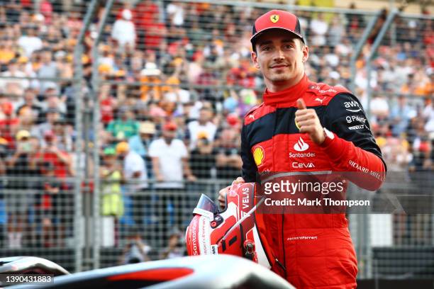 Pole position qualifier Charles Leclerc of Monaco and Ferrari celebrates in parc ferme during qualifying ahead of the F1 Grand Prix of Australia at...