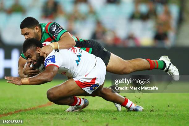 Mikaele Ravalawa of the Dragons is tackled by Taane Milne of the Rabbitohs during the round five NRL match between the South Sydney Rabbitohs and the...