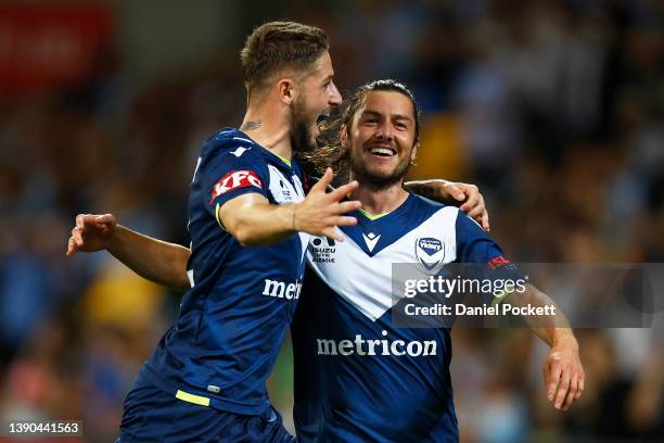 Marco Rojas of the Victory celebrates with Jake Brimmer of the Victory kicking a goal during the A-League Mens match between Melbourne Victory and...