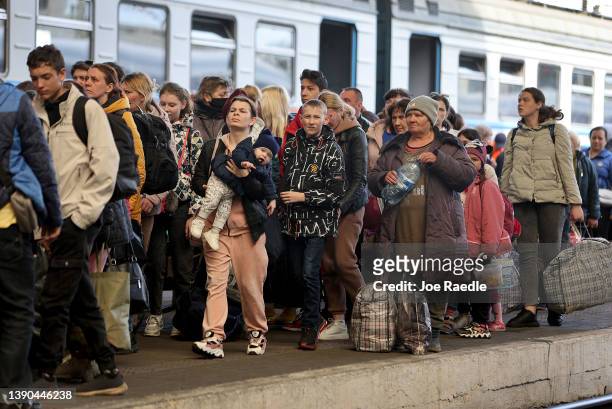 People fleeing the Russian military campaign in eastern Ukraine arrive at the central train station on the train from Dnipro on April 09, 2022 in...
