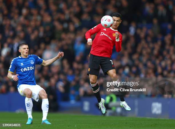 Cristiano Ronaldo of Manchester United jumps for the ball during the Premier League match between Everton and Manchester United at Goodison Park on...