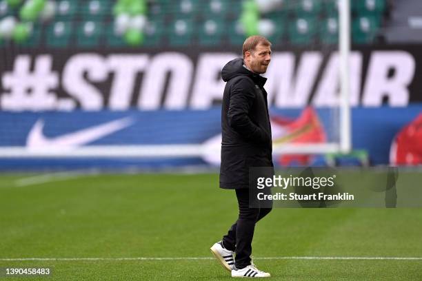 Frank Kramer, Head Coach of DSC Arminia Bielefeld inspects the pitch prior to the Bundesliga match between VfL Wolfsburg and DSC Arminia Bielefeld at...