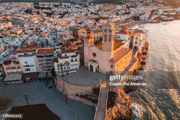 sand beach and historical old town in mediterranean resort sitges near barcelona, costa dorada, catalonia, spain - barcelona coast stock pictures, royalty-free photos & images