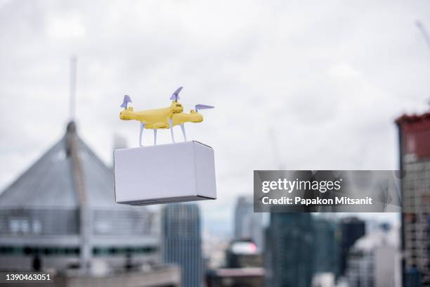 transport drones can be used to transport small items across buildings without the need for a walker. - drone parcel stock pictures, royalty-free photos & images