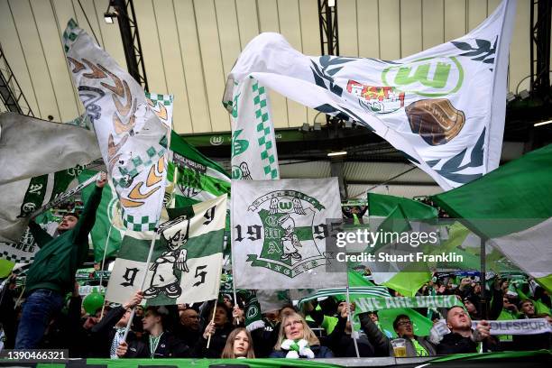 VfL Wolfsburg fans show their support prior to the Bundesliga match between VfL Wolfsburg and DSC Arminia Bielefeld at Volkswagen Arena on April 09,...