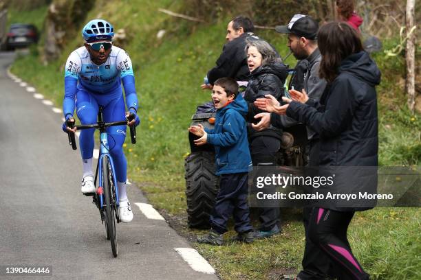 Tsgabu Gebremaryam Grmay of Ethiopia and Team BikeExchange - Jayco competes in the chase while fans cheer during the 61st Itzulia Basque Country 2022...