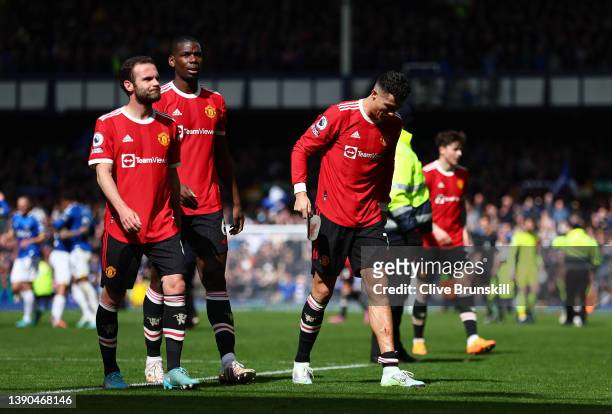 Juan Mata, Paul Pogba and Cristiano Ronaldo of Manchester United look dejected following their side's defeat in the Premier League match between...
