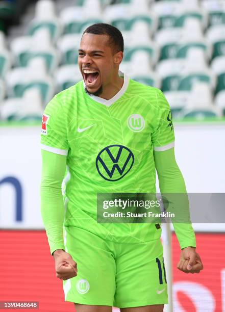 Lukas Nmecha of VfL Wolfsburg celebrates after scoring their team's first goal during the Bundesliga match between VfL Wolfsburg and DSC Arminia...