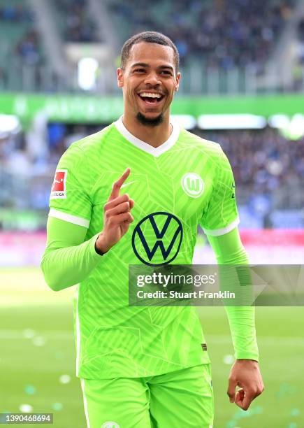 Lukas Nmecha of VfL Wolfsburg celebrates after scoring their team's first goal during the Bundesliga match between VfL Wolfsburg and DSC Arminia...