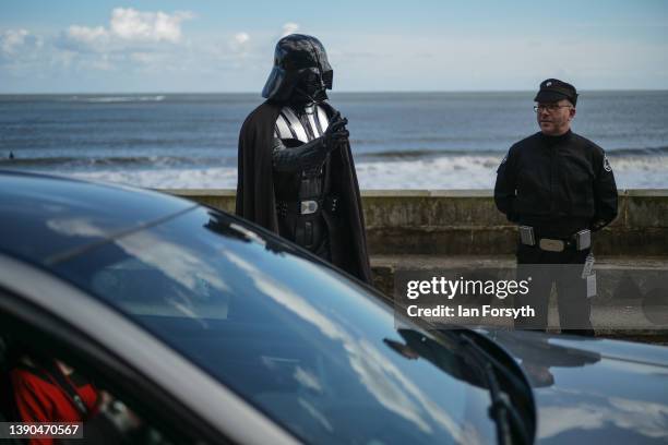 Man dressed as the Star Wars character Darth Vader directs traffic on the first day of the Scarborough Sci-Fi weekend at the seafront Spa Complex on...