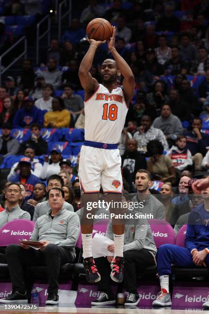 Alec Burks of the New York Knicks shoots against the Washington Wizards during the first half at Capital One Arena on April 08, 2022 in Washington,...