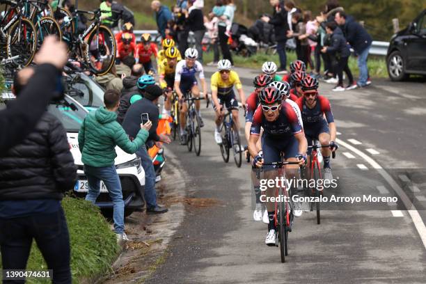 Tao Geoghegan Hart of United Kingdom, Omar Fraile Matarranz of Spain and Geraint Thomas of United Kingdom and Team INEOS Grenadiers lead the peloton...