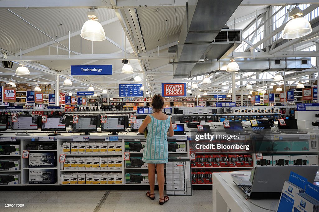 Small Computer Officeworks A shopper browses laptop computers at a Wesfarmers Ltd. Officeworks ...