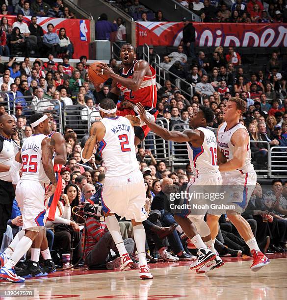 John Wall of the Washington Wizards attempts a shot at midcourt against Mo Williams, Kenyon Martin, Eric Bledsoe, and Blake Griffin of the Los...