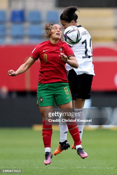 Andreia Norton of Portugal and Dzsenifer Marozsan of Germany go up for a header during the FIFA Women's World Cup 2023 Qualifier group H match...