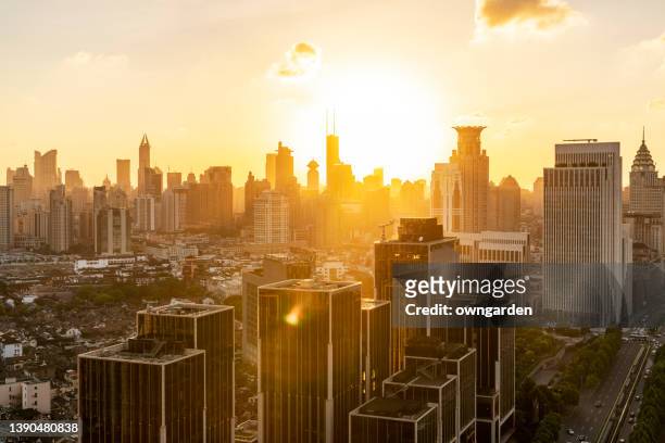 aerial view of shanghai urban skyling at sunset - shanghai sunset stock pictures, royalty-free photos & images