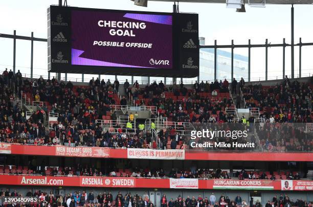 The LED screen shows the VAR decision which later ruled out Arsenal's first goal for an offside during the Premier League match between Arsenal and...