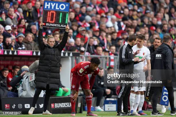 Kingsley Coman of FC Bayern Muenchen prepares to come onto the pitch during the Bundesliga match between FC Bayern Muenchen and FC Augsburg at...