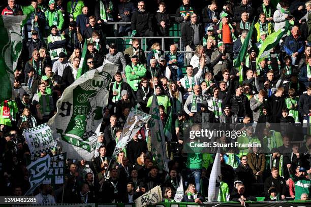 VfL Wolfsburg fans show their support during the Bundesliga match between VfL Wolfsburg and DSC Arminia Bielefeld at Volkswagen Arena on April 09,...