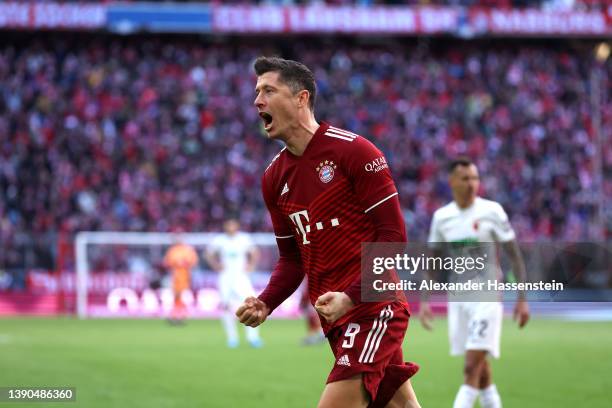 Robert Lewandowski of FC Bayern Muenchen celebrates after scoring their side's first goal from a penalty during the Bundesliga match between FC...