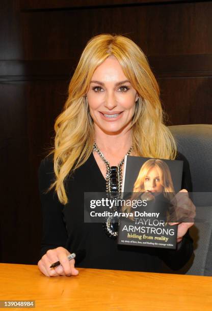 Taylor Armstrong signs copies of her book "Hiding from Reality: My Story Of Love, Loss, And Finding The Courage Within" at Barnes & Noble bookstore...